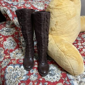 Vince Camuto knee-high brown boots.